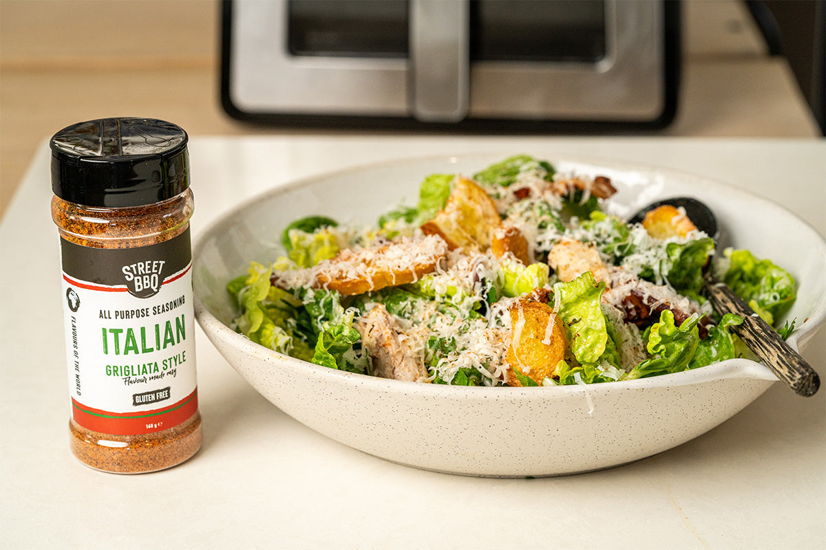 Air fryer halal chicken Caesar salad with sliced crispy chicken breast over romaine Parmesan and Caesar dressing for 19 minute weeknight dinner